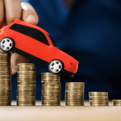 a photo of a toy car on some money indicating personal loans